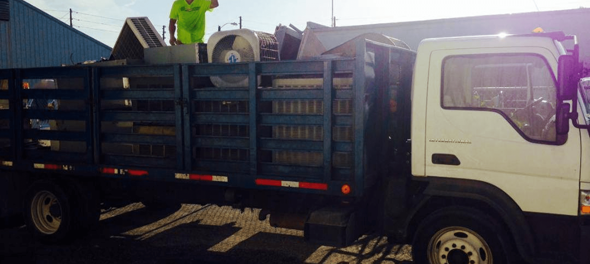 Worker standing in loaded truck