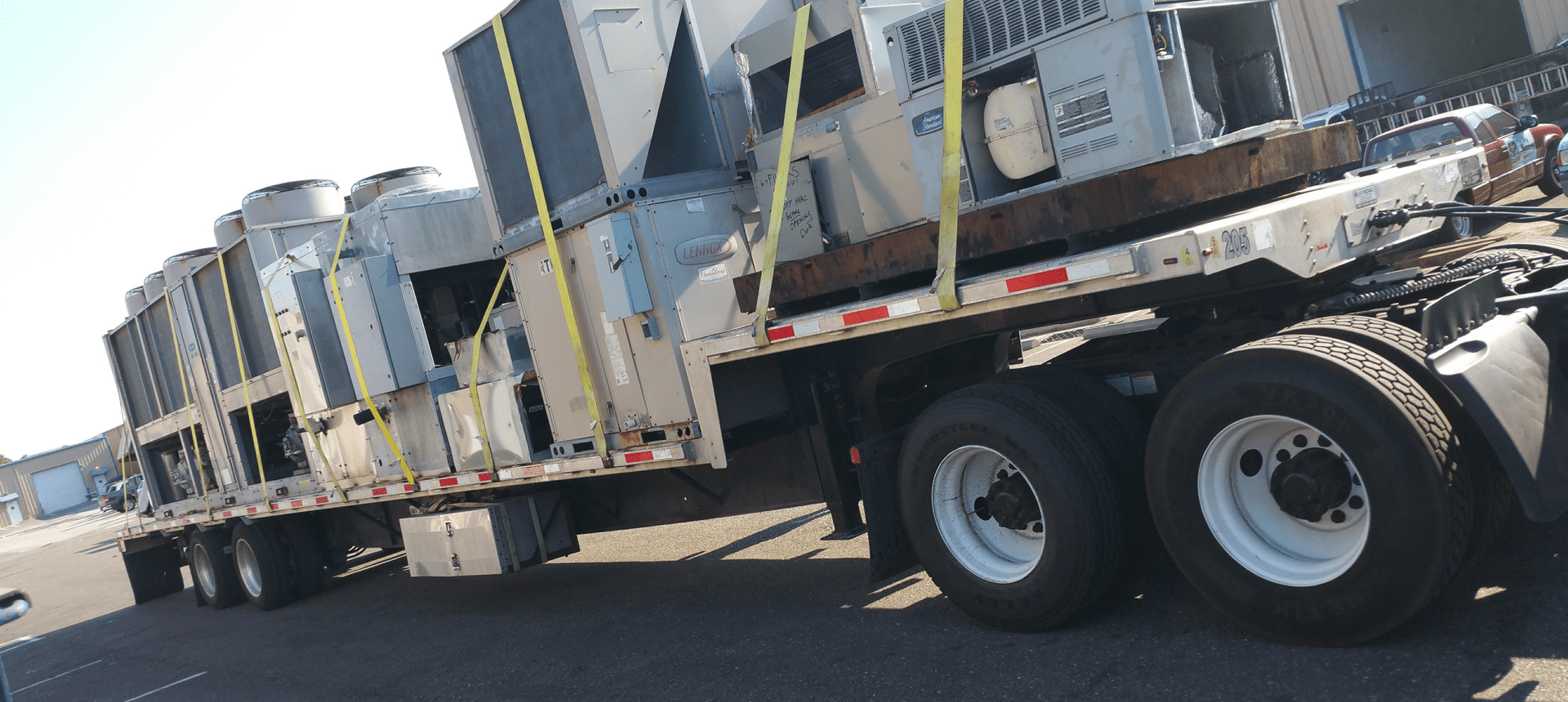 Large metal units on trailer
