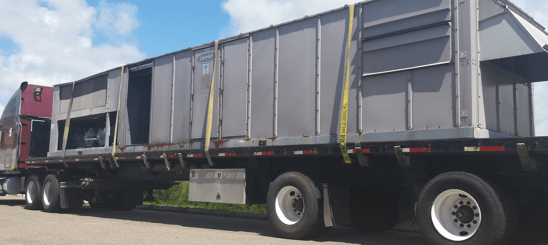 Industrial container on flatbed semi-truck